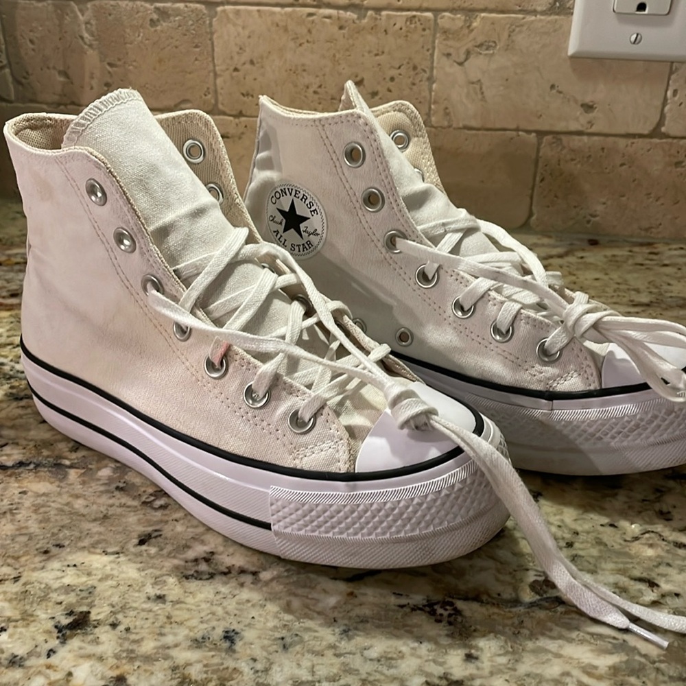 Converse Hightop Platform white shoes.